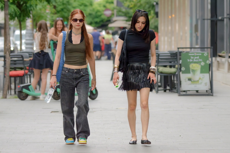 Two girls walking on the street